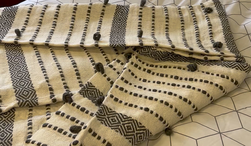 A throw to go over your student bed