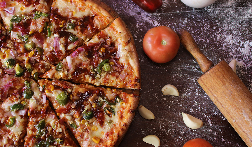 Healthy home made pizza you can make in your student home Pizza on a chopping board