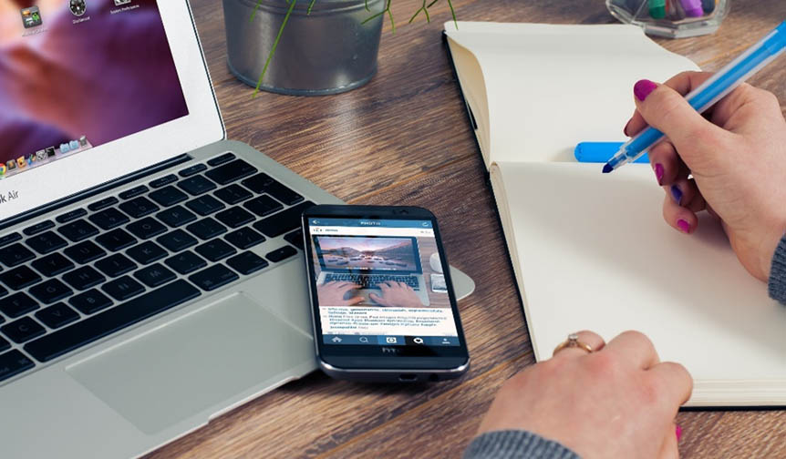 Loughborough student researching on mobile phone