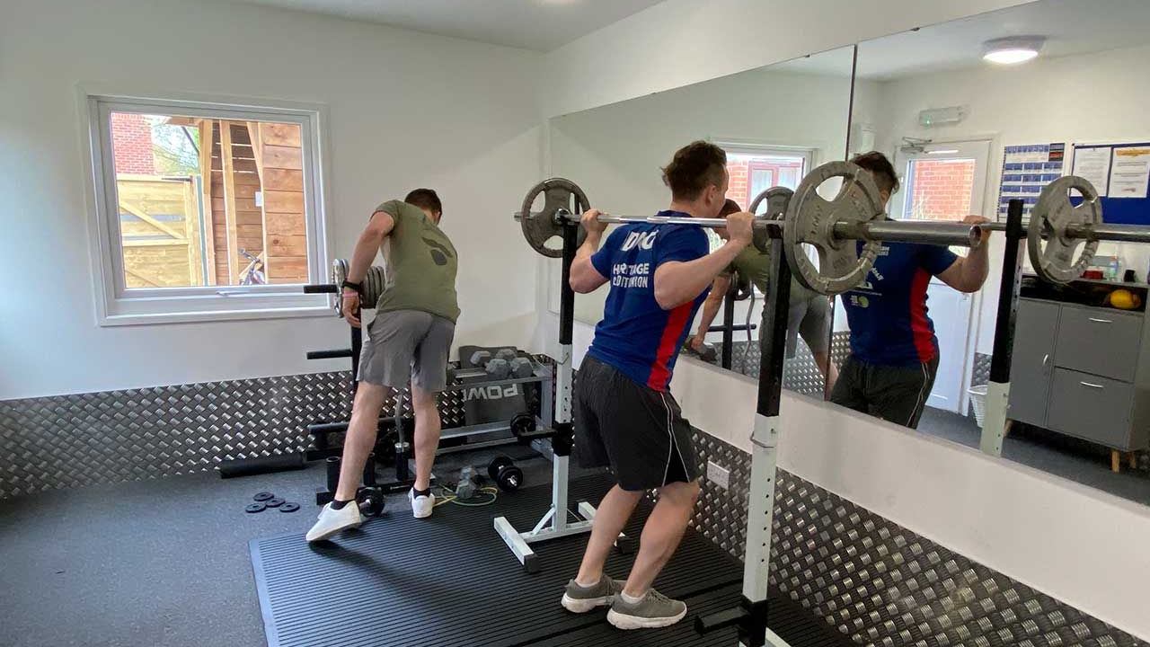 Modern student lounge with study area and vending machines and gyms