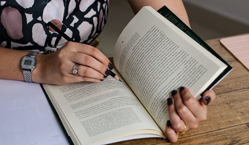 Loughborough university student studying on stairs