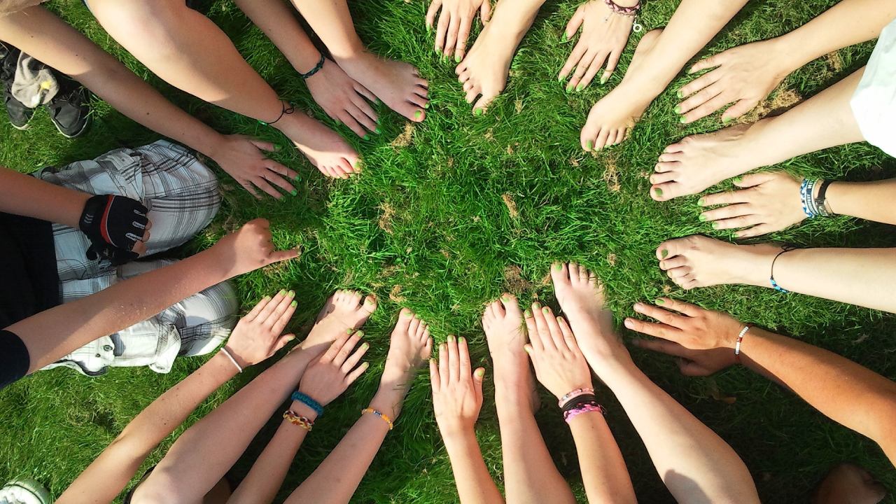 Students at Leicester University stood with their hands in a circle