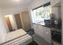 Regent Road Leicester Student Accommodation: Superior Studio - Large studio room with desk, kitchen and double bed side view