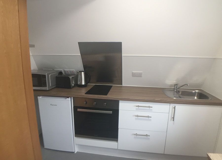 Renaissance House Loughborough Student Accommodation: Standard studio - Kitchen with Hob, sink, fridge and microwave