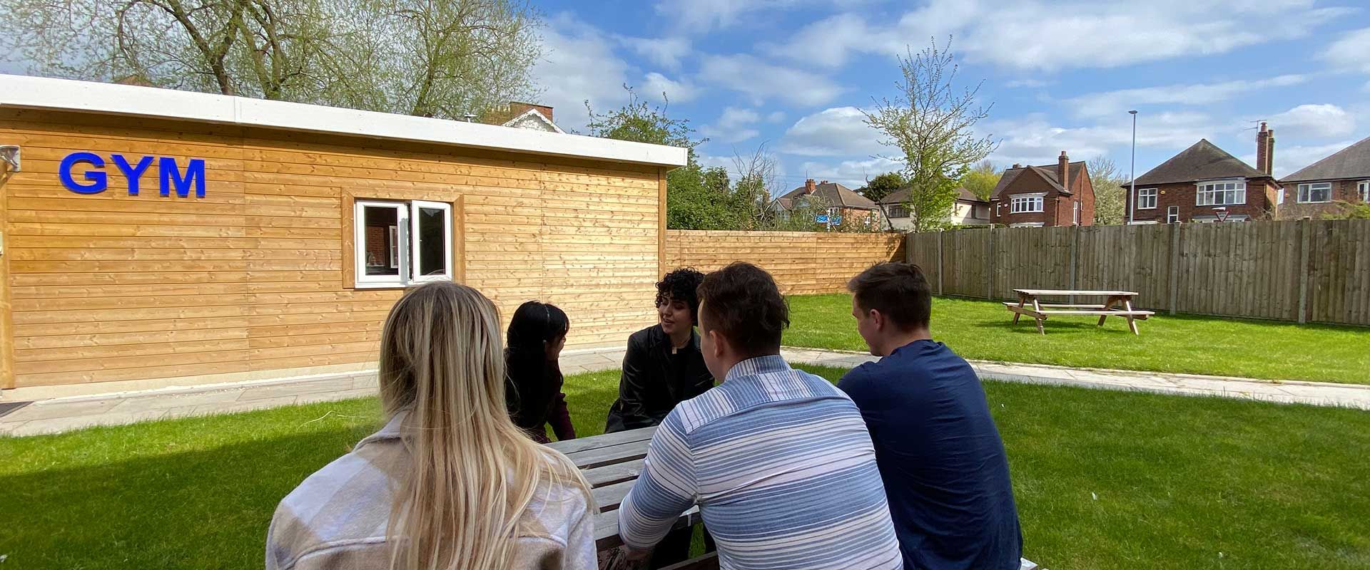 Kingfisher Halls Loughborough student accommodation - Relax in the sun with your flatmates 