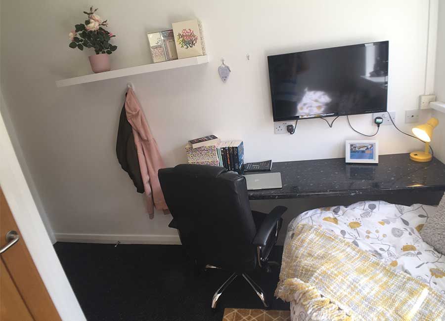 Forest Court Loughborough Student Accommodation Gold bedroom with study area and TV for students