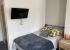 Renaissance House Loughborough Student Accommodation: Superior studio - Large double bend with side table and TV