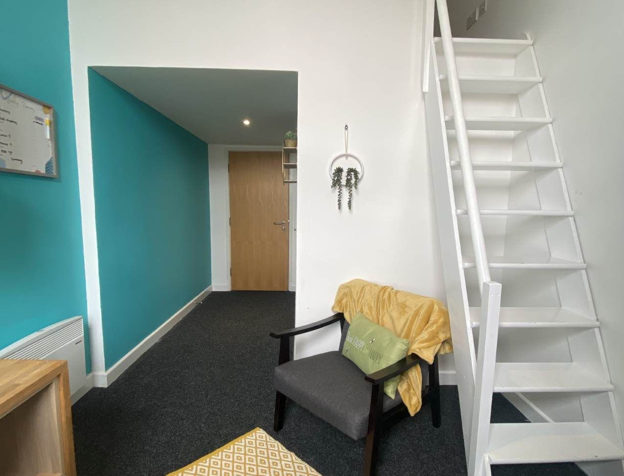 Radmoor House Student Room: Ensuite Mezzanine Room - Stairs to bedroom and seating area